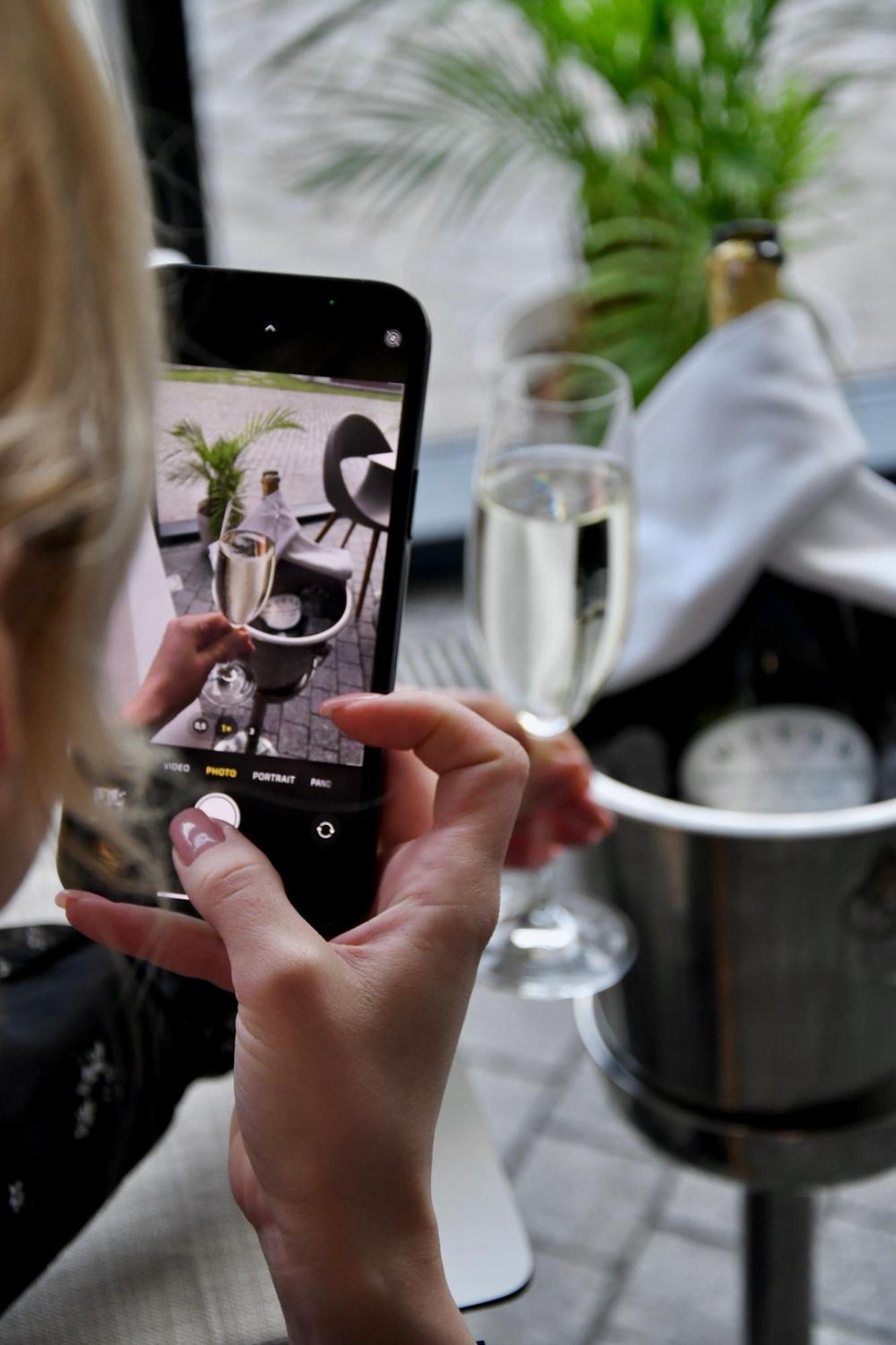 Doubletree By Hilton Wroclaw Hotel Exterior photo A woman taking a photo with a mobile phone